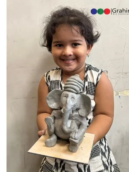 It’s amazing to see what young hands can create. This little artist is all smiles with her wonderfully detailed eco-friendly Ganpati idol.