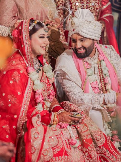 A candid shot of the couple sharing a laugh during their wedding ceremony. This image perfectly captures the genuine joy and lightheartedness of their relationship on their big day.