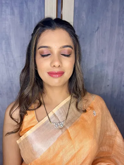 The makeup features a light wash of pink eyeshadow and a glossy lip, a perfect example of my "no-makeup" makeup service.