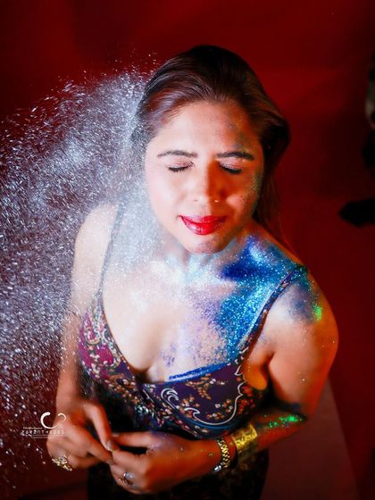 A moment of pure, expressive joy, captured with a splash of glitter. This shot is about celebrating life and embracing a bit of magical chaos.