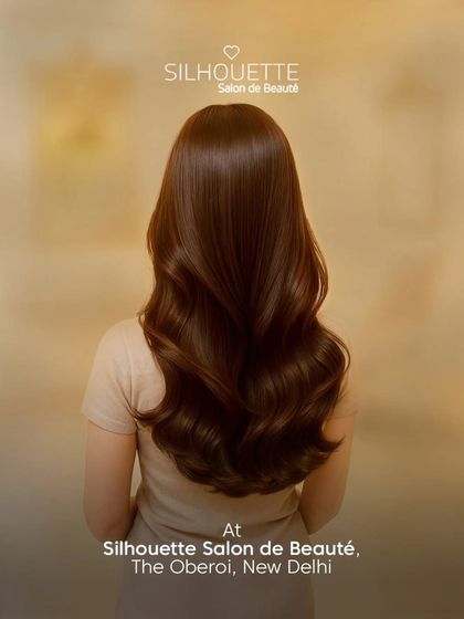 Rich, healthy-looking hair styled into voluminous waves. Our signature styling service is perfect for achieving that smooth, polished look, even in humid weather.