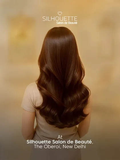 Rich, healthy-looking hair styled into voluminous waves. Our signature styling service is perfect for achieving that smooth, polished look, even in humid weather.
