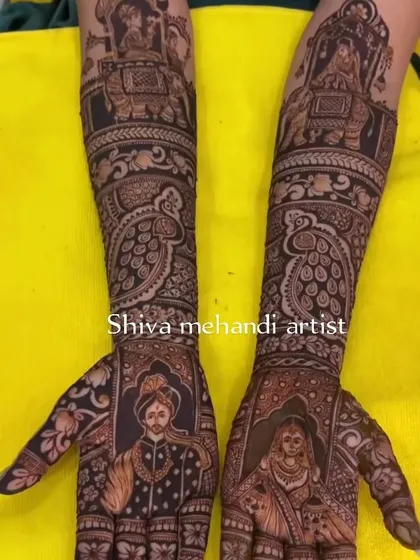 A classic portrait design with the bride and groom on the palms. The forearms are decorated with elaborate peacock and elephant motifs, symbolizing grace and strength.