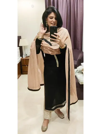 For a 50th wedding anniversary, I styled this black kurta with bling pants and a sequined dupatta from an old lehenga. It’s a great example of restyling and mixing pieces to create a new, festive look.