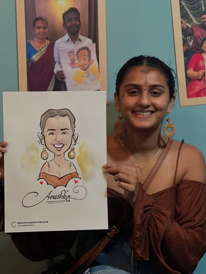 A happy guest holding her finished portrait. I use a mix of line work and subtle watercolors to make each caricature pop. Every sketch is a unique piece of art, capturing the personality of the person sitting in front of me.