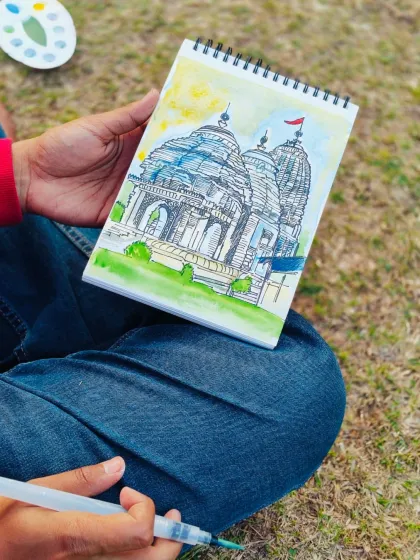 A close-up of my live sketch of the temple. I used a water brush and a small paint palette to add color to the ink drawing on the spot.