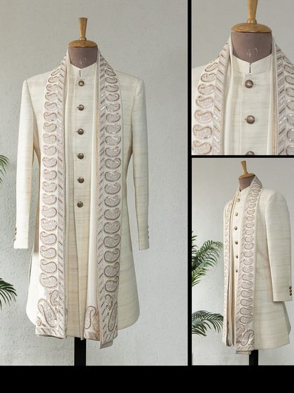 This classic Matka Silk Achkan in ivory, teamed with a paisley dupatta, is a timeless ensemble for any celebration.