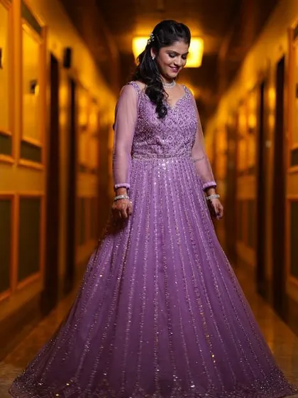 Another gorgeous shot of the bride in her purple engagement gown. The soft curls and glam makeup completed her fairytale look.