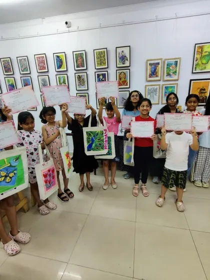 The happy faces of our tote bag workshop participants, holding their certificates of completion. We believe in celebrating every creative achievement!