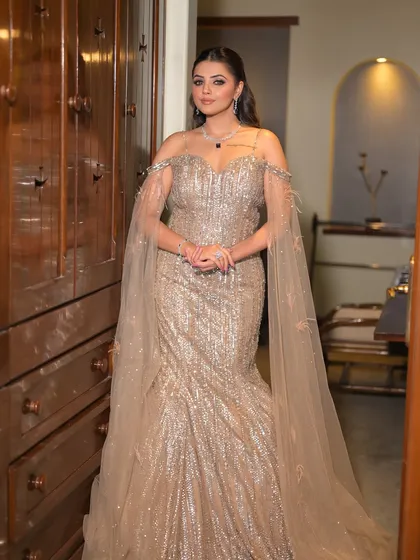 Slaying with a touch of sparkle. This angle shows off the beautiful silhouette of the gown and the elegant flow of the Hollywood waves, a perfect combination for a modern bridal event.