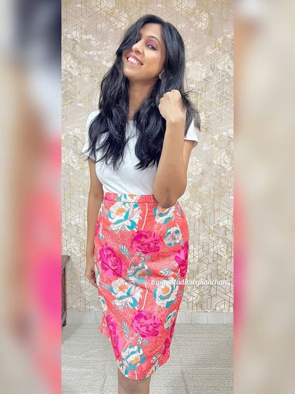 Another view of our digitally printed muslin skirt. The vibrant pink floral design is perfect for creating an elegant and comfortable outfit.