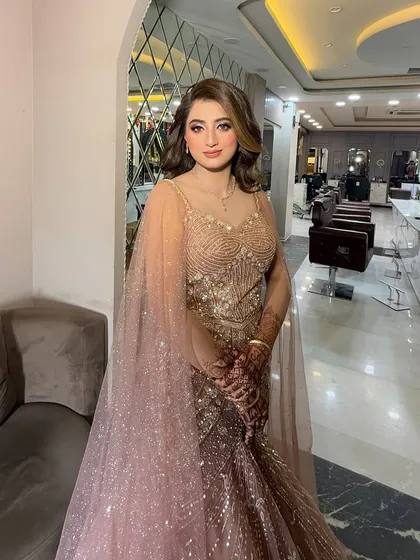 Today's beautiful engagement bride in a dusty pink gown. We gave her a soft, shimmery makeup look with purple tones on the eyes.