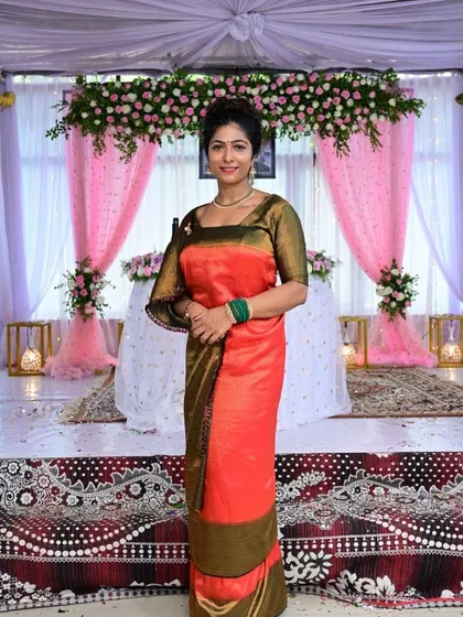 Another look at the traditional Coorgi saree against the backdrop of the wedding decorations.