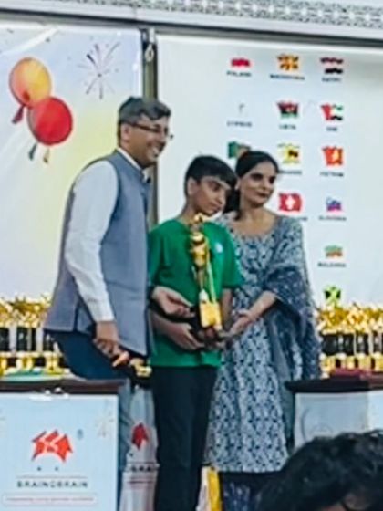 A proud moment for a student and his family as he receives his trophy at the Brainobrainfest. We believe parental support is a key ingredient for a child's success.