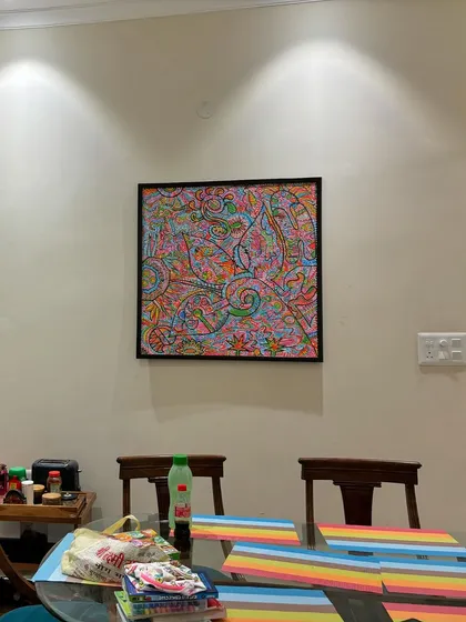 The artwork seen from across the dining table. It serves as a beautiful, vibrant focal point for the room.