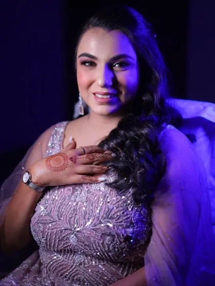 A pretty party look for an evening event. The soft glam makeup with a focus on the eyes complements her lavender gown perfectly.