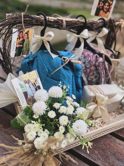 The complete look of the hanger hamper, combining florals, fashion, and personal touches for a truly special birthday surprise.