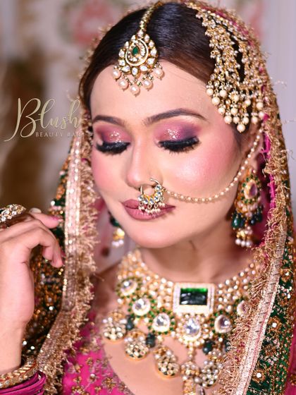 For this Muslim bridal look, I created a dramatic smokey eye with a pop of pink glitter. The skin is kept luminous and the lips are a soft nude, balancing the bold eyes and heavy jewelry perfectly.