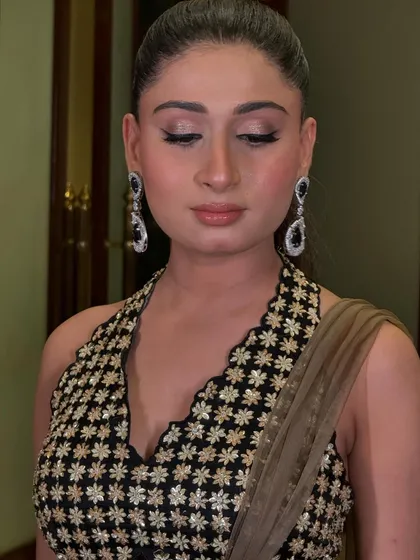 A close-up of the winged eyeliner and glossy skin from the fashion shoot.