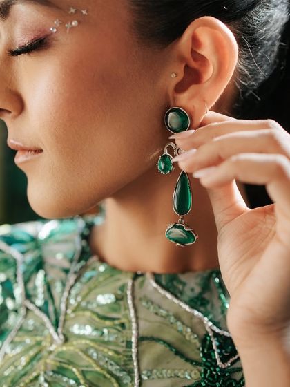 This unique jungle-themed mehendi look is a great example of creative artistry. You'll learn how to incorporate fun elements like facial gems to match a theme.