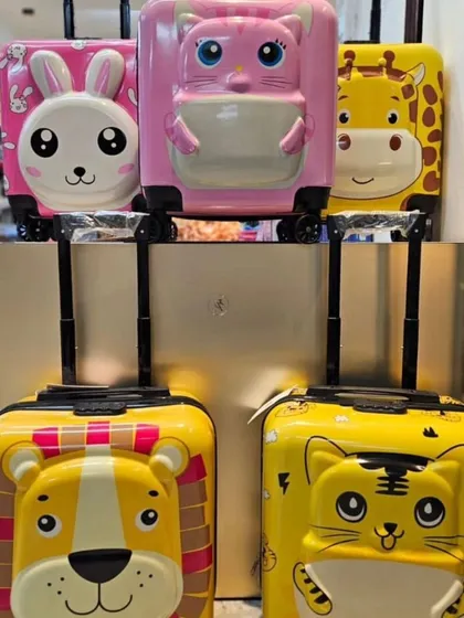 I've got these premium quality hard-shell trolley bags that make traveling a blast for kids. This shot shows some of the fun 3D animal designs available, including the lion, tiger, bunny, and giraffe.