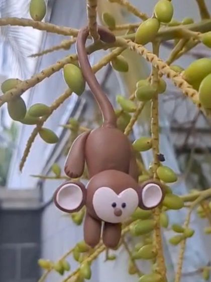 A cheeky little monkey hanging in the garden. This was a fun, playful piece to create.