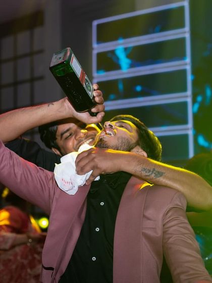 The party is in full swing as a guest enjoys a drink poured directly by one of my energetic bartenders. It's all about creating a high-energy, celebratory vibe.