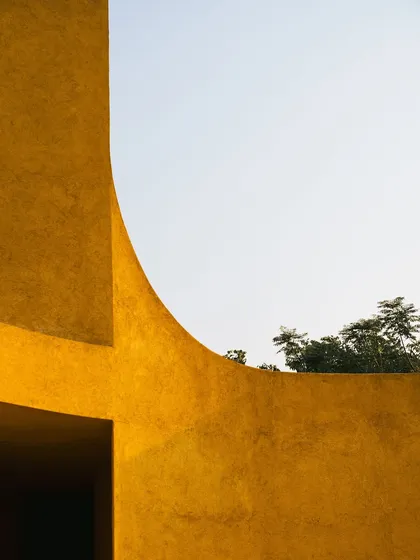 The curved architecture frames a perfect slice of the sky, reminding us to look up and appreciate the vastness above.