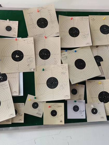 Our 'Wall of Fame' at the academy, covered with the best scorecards from our students. It serves as a visual reminder of what can be achieved with dedication.