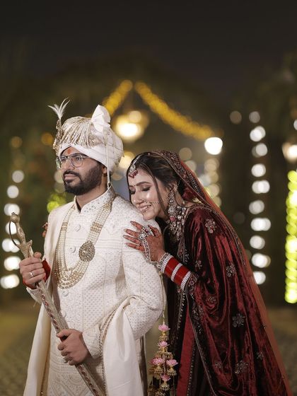 A candid and romantic moment. The bride's soft and glowing makeup looks beautiful even in the warm lighting of the evening.
