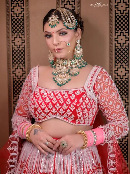 A classic portrait pose, capturing the bride's direct and engaging gaze.