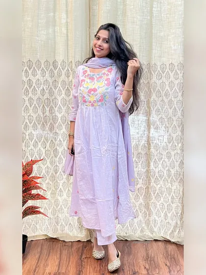 For your special celebrations, I designed this elegant lavender Anarkali suit. It features delicate floral embroidery on the yoke and is crafted from soft, pure cotton for all-day comfort.