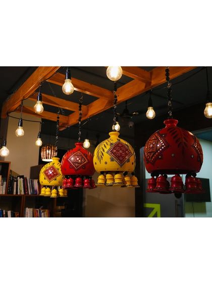 These colorful, hand-painted lamps are a signature part of our decor. They add a touch of traditional artistry and warmth to the space, hanging above our community library.