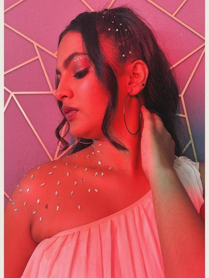 A creative and fun party look with face and body gems for extra sparkle.