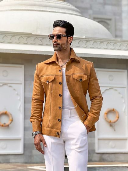 The jacket's warm camel color is beautifully captured in the sunlight, showcasing its versatility for daytime wear.