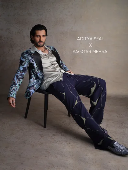 For Aditya Seal's feature in FHM India, I created this printed tuxedo to merge semi-formal sophistication with a relaxed charm. The look features a vibrant paisley print, a satin lapel, and uniquely patterned trousers, showcasing a bold approach to modern tailoring.