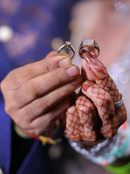 A close up of the engagement rings, symbolizing the start of a new journey. I make sure to capture these important details, from the intricate henna designs to the sparkle of your new rings.