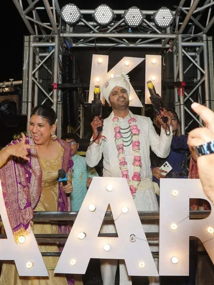 A fun, candid shot with the groom on the baraat truck. We're a team, ready to get the party started.