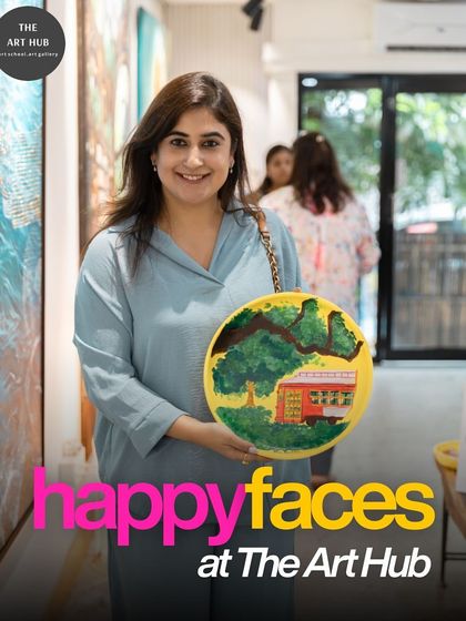 A participant from a corporate workshop proudly shows off her finished artwork. These sessions are a great way for teams to de-stress and connect outside the office.