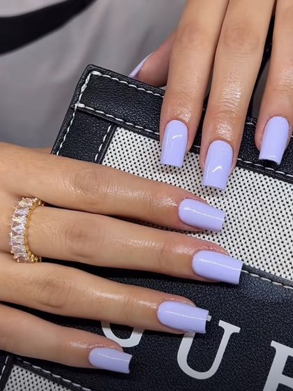 A lovely pastel lavender color on medium-length square nails. This soft and pretty shade is a popular choice for spring.