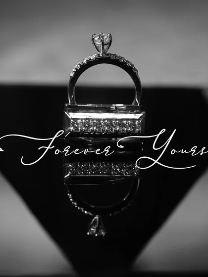 The rings are a symbol of your promise, and they deserve a special portrait of their own. This artistic, black and white shot focuses on the beauty of the rings, reflecting them to create a sense of infinity.
