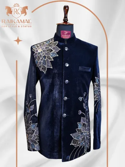 This navy blue velvet Bandhgala is the epitome of sophisticated style. The detailed floral threadwork embroidery on the shoulder and sleeve adds a touch of artistry, making it an ideal choice for a formal evening affair.