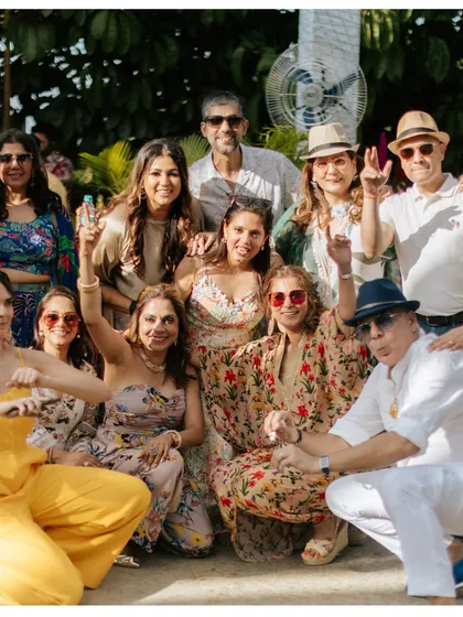A great group shot of all the guests enjoying the sun and fun at the pool party.