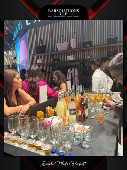 The bar in full swing, with guests enjoying the vibrant atmosphere and custom drinks at the Armani Exchange event.