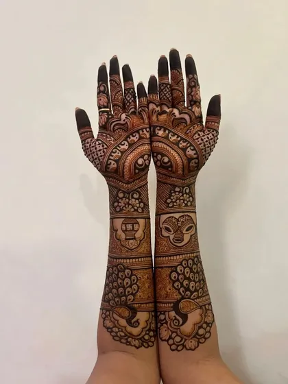 A beautiful design with peacocks and other traditional motifs.
