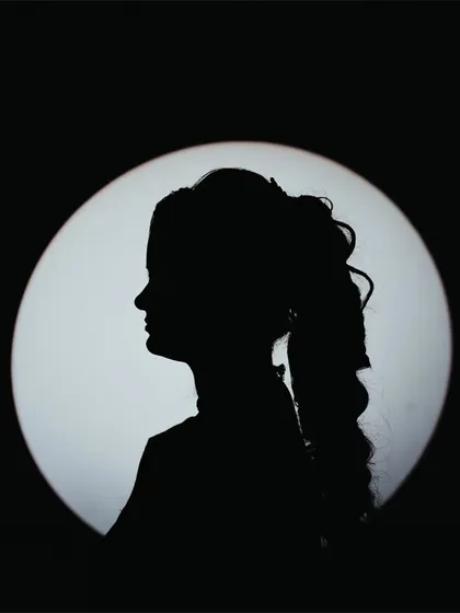 A simple yet powerful silhouette portrait of a bride, using a single light source to create a graphic and timeless image.