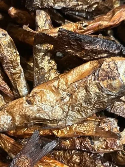 These are whole smoked fish, a key ingredient for making flavorful broths and chutneys. They are preserved using traditional methods to lock in a deep, smoky taste.