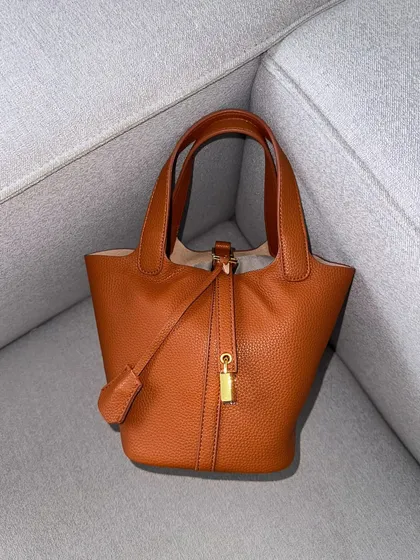 The HerCharm Bucket Bag in a classic LV brown. This rich, warm colour is timeless and looks very high-end.
