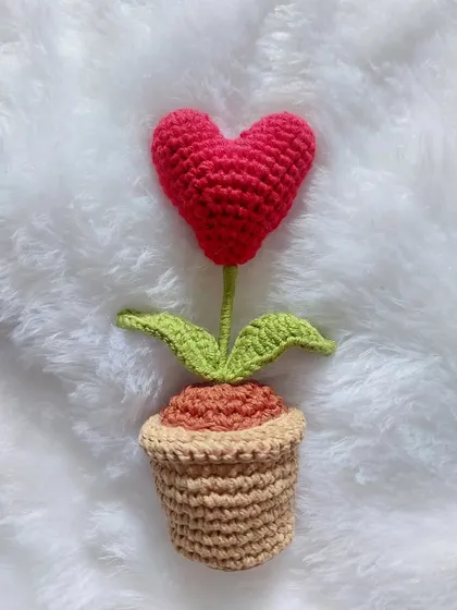 This is my Heart Pot amigurumi, a sweet little potted plant with a heart-shaped flower. It's the perfect desk buddy to brighten your day.