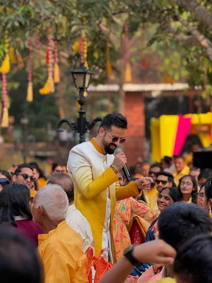 Interacting with the crowd during a Haldi Hungama in Alibag. Getting off the stage and into the audience is key to my interactive style.